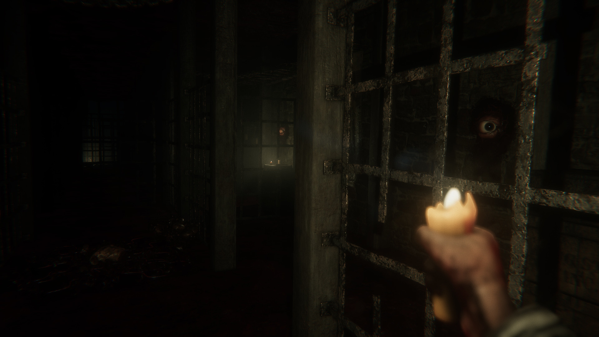 An eye watching through the bars of a dark cell